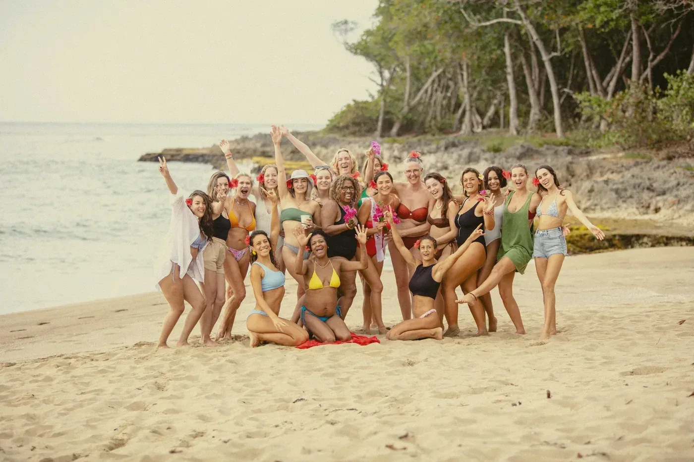 A big group of friends celebrating on a beach near Cabarete