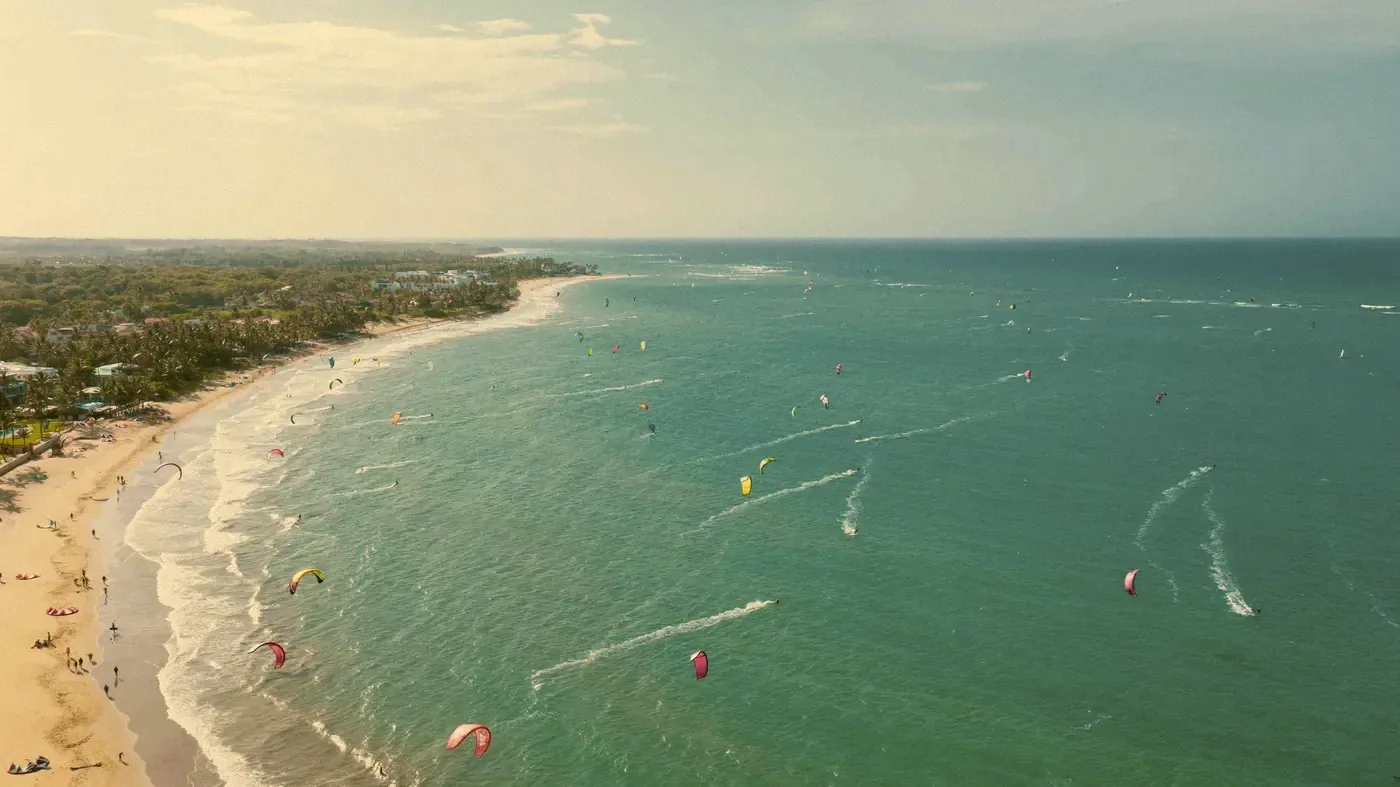 Aerial view of Kite Beach in Cabarete with kitesurfers on the turquoise water