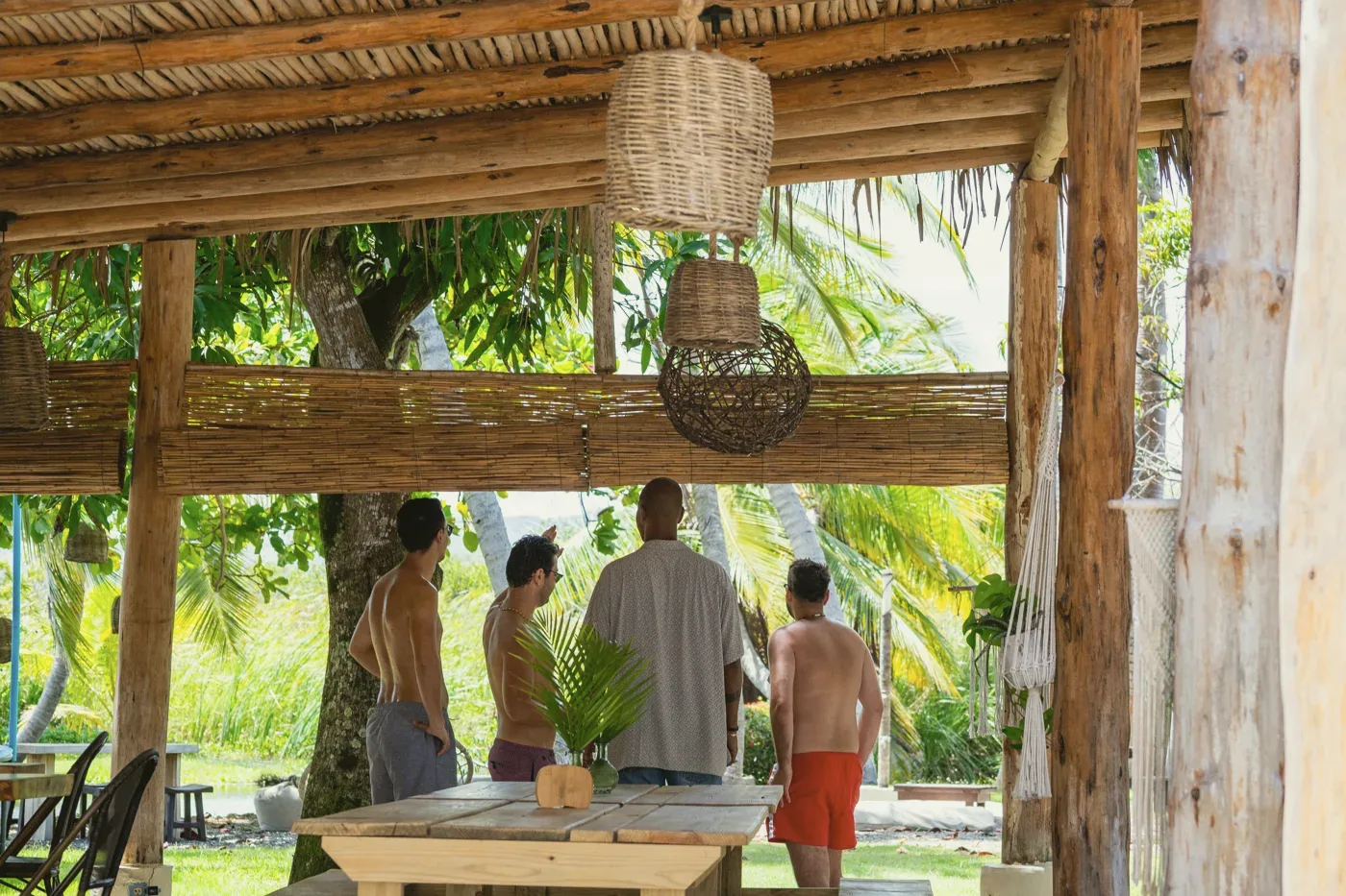 A group talking together under the garden pavilion