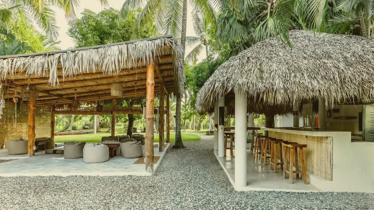 The garden lounge and bar under the thatched roofs